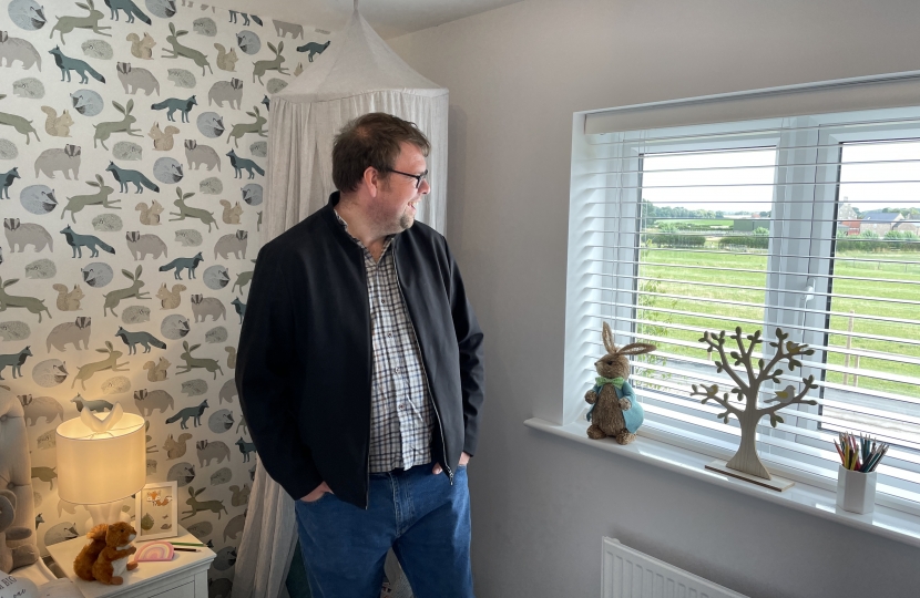 Mark in Keepmoat Homes show home overlooking the view on the development