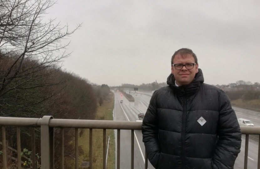 Mark standing on Ball Hill Bridge overlooking J28 slip road