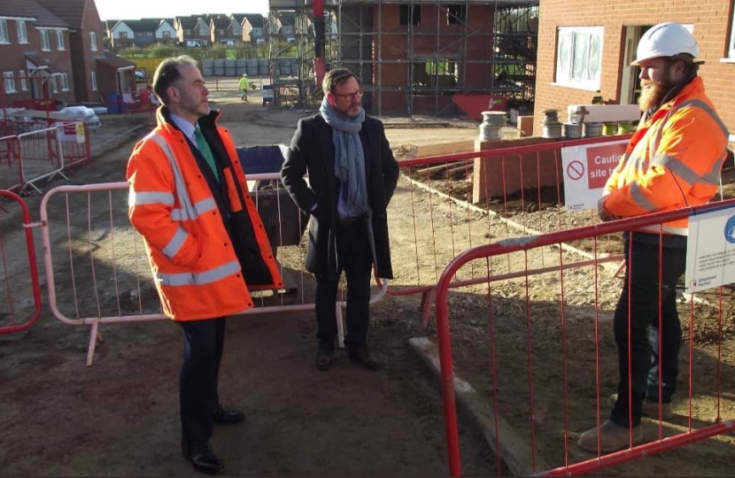 Christopher Pincher MP talking to workers on building site
