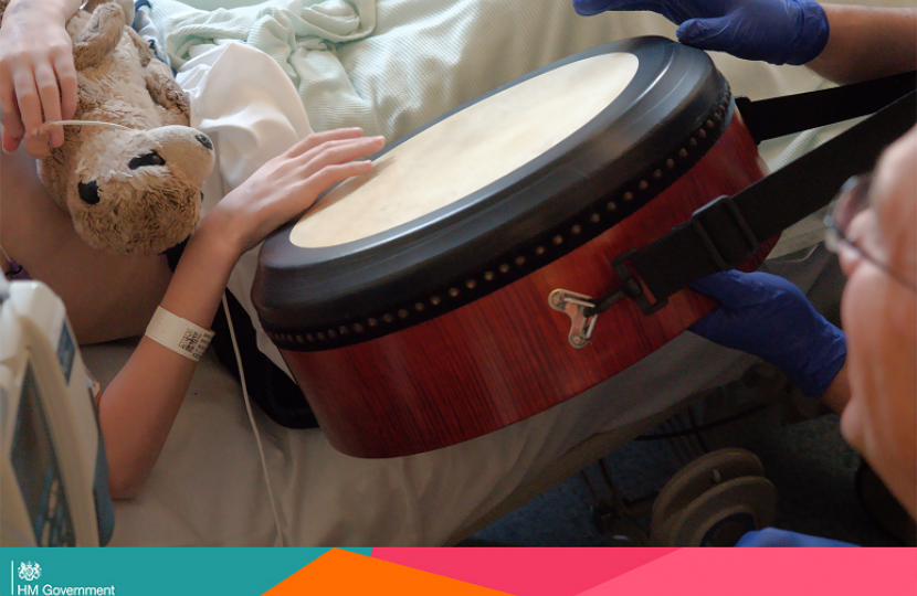child in hospital with a drum