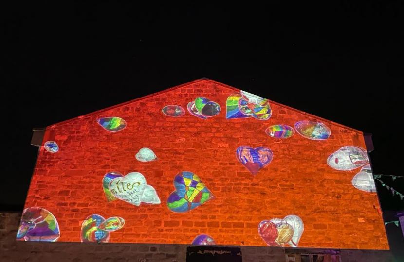 wall projection of local peoples hearts