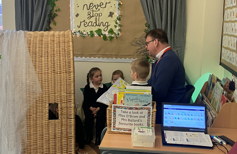 Mark reading with Children at The Green Infant School