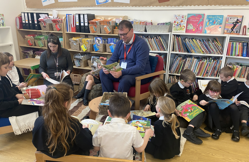Mark reading with Children at the Green Infant School