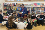 Mark reading with Children at the Green Infant School